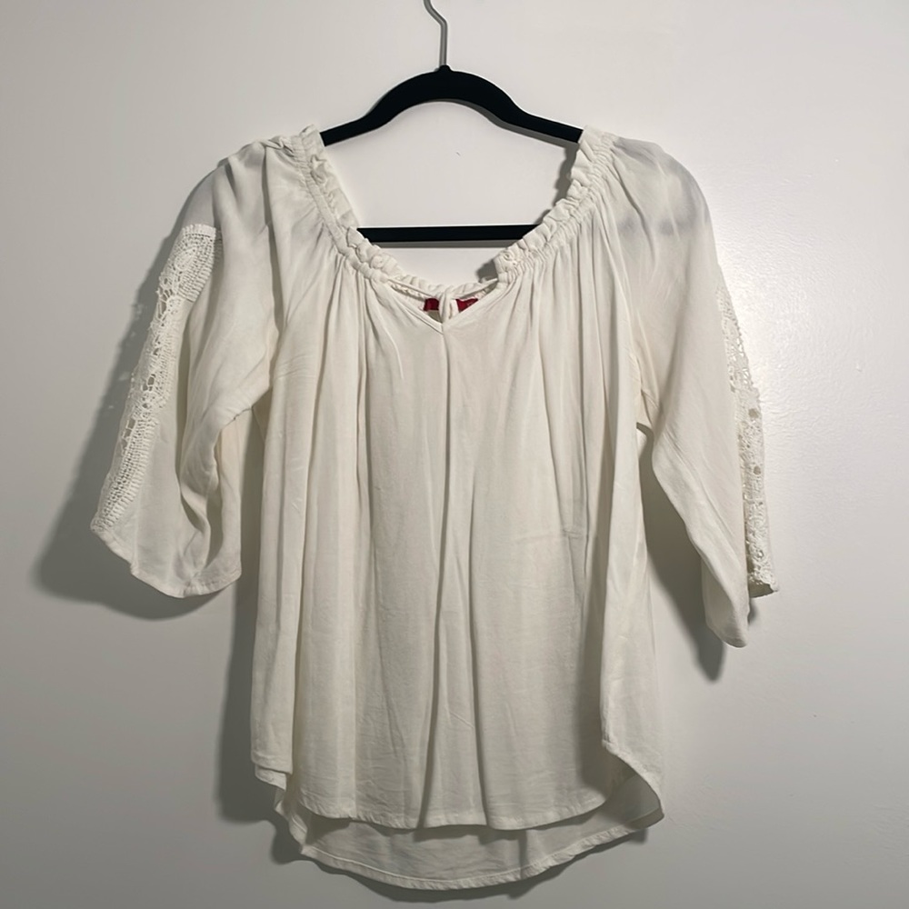 White blouse with sleeve lace detailing